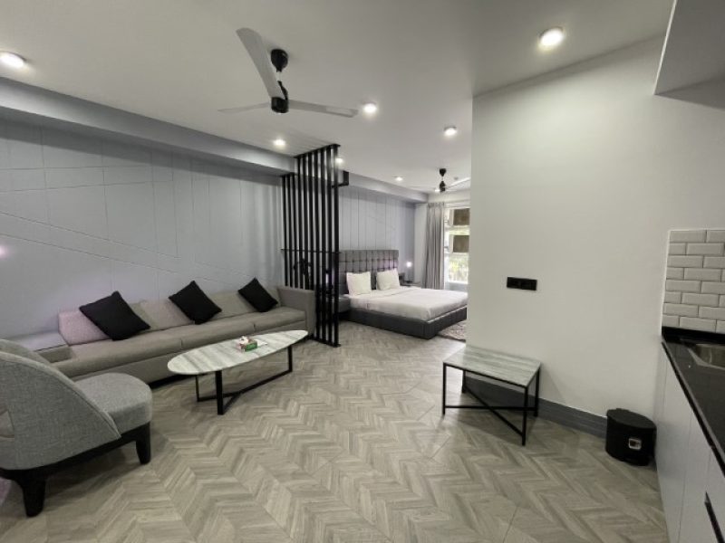 Wide angle view of Living room and Bedroom in one frame of Studio apartment, Service apartment near MG Road