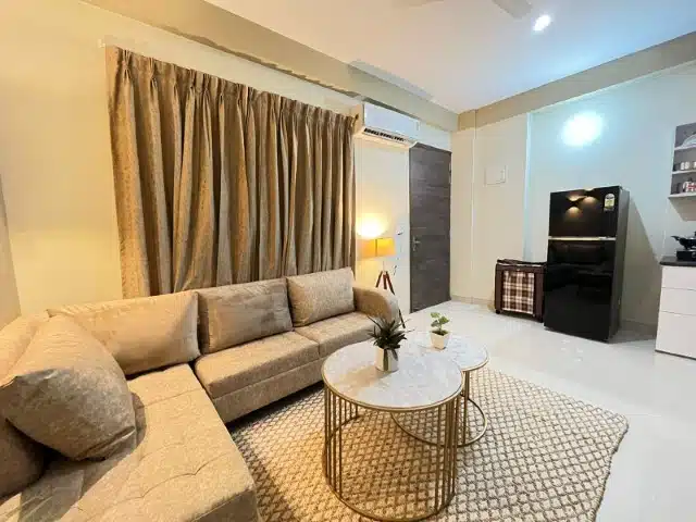 Living room with fridge, service apartment near medanta